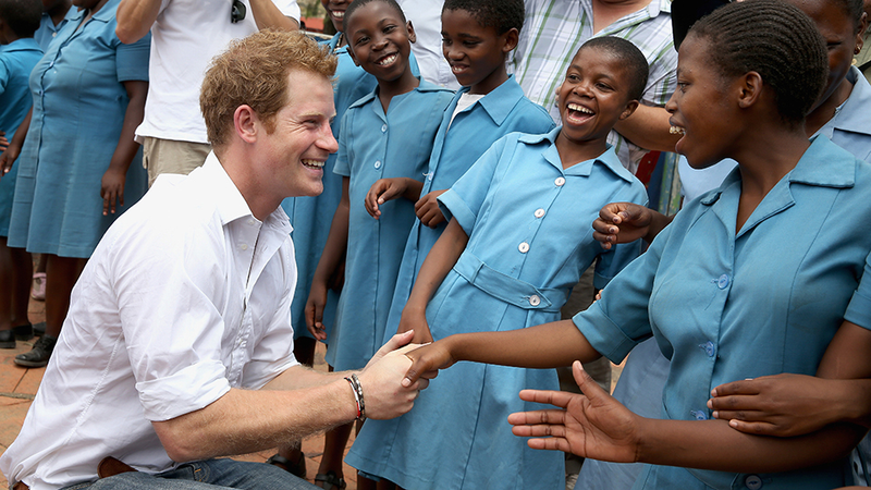 Illustration for article titled Your Boyfriend Prince Harry Grins His Way Through a Visit to Lesotho
